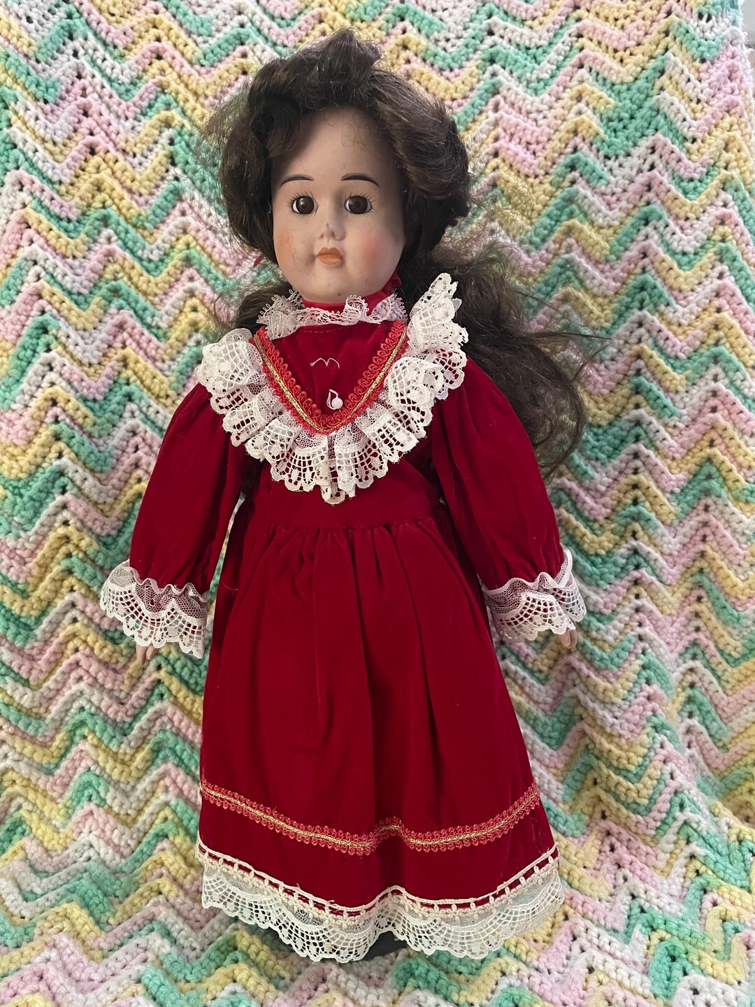 17” Vintage Porcelain Doll Wearing Red Velvet Dress and Cream Colored Shoes