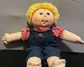 Cabbage Patch Doll wearing overalls - Blond Hair - Blue Eyes