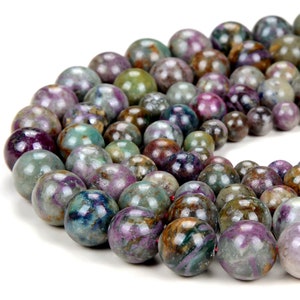 May include: A strand of round, multi-colored gemstone beads. The beads are a mix of green, purple, brown, and blue with a speckled pattern.