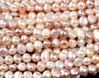 May include: A strand of pink, white, and peach freshwater pearls. The pearls are irregular in shape and have a smooth, lustrous finish.
