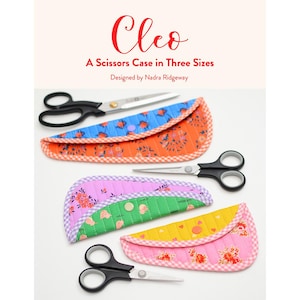 May include: The image showcases three colorful, quilted scissor cases in various sizes, each paired with a pair of scissors. The cases feature floral and geometric patterns in shades of orange, blue, pink, green, and yellow. Text on the top reads "Cleo A Scissors Case in Three Sizes".