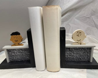 Wooden “stonewall” bookend with friends Franklin and Charlie Brown.