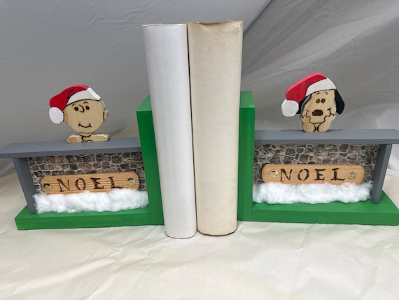 Wooden “stonewall” bookend with Charlie Brown and Snoopy dreaming of Christmas. #3