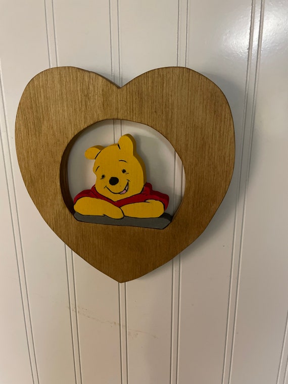 Wooden wall hangings of Winnie the Pooh and friends