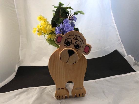 Wooden Monkey planter with plastic flowers