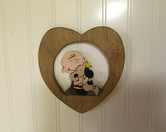 Wooden Wall Hanging with Charlie Brown hugging Snoopy and Woodstock