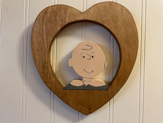 Wooden wall hangings of Charlie Brown and buddies
