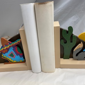 Wooden bookend of a scene from the Old Southwest