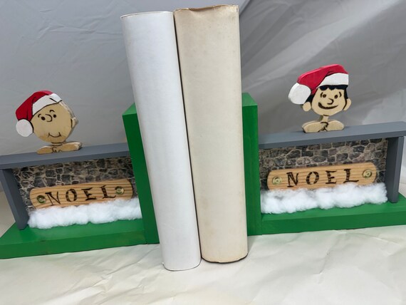 Wooden “stonewall” bookend with Charlie Brown and Lucy dreaming of Christmas. #2