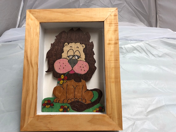 Wooden shadow box of a friendly lion