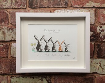 May include: A framed drawing of five rabbits in a line, with the text "The Grandchildren" above them and the names "Erin, Neve, Phoebe, Henry, Bethany" below them.