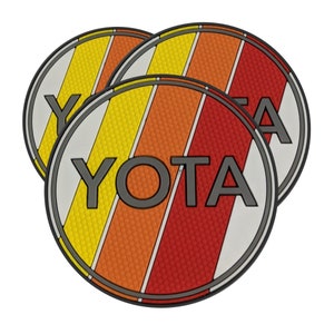 May include: Three round coasters with a retro design. Each coaster features a white circle with the word "YOTA" in gray, and diagonal stripes in yellow, orange, and red. The coasters have a black border.