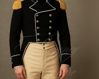 May include: Black military-style jacket with gold epaulettes and white trim. The double-breasted jacket features silver buttons and is paired with tan pants. A formal, historical-inspired garment.