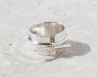 Wide ring open in front closed with a ring with bar, wide ring with bar charm