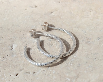 Twisted embossed hoop earrings in solid silver