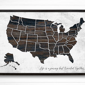 May include: A black and white map of the United States with a wood grain texture. The map is framed in black and has the text "Life is a journey best traveled together" at the bottom.