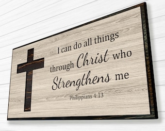 May include: A wooden sign with a black cross and the text "I can do all things through Christ who strengthens me Philippians 4:13".