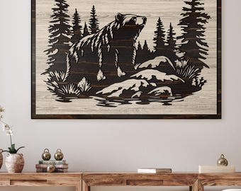 May include: A black and white wood wall art featuring a silhouette of a bear standing on a rock in a forest setting. The bear is facing to the right and looking up. The background is a wood grain pattern.
