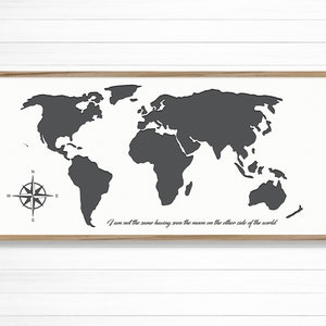 May include: A black and white world map print with a compass and the quote "I am not the same having seen the moon on the other side of the world".