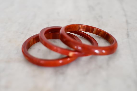 Set of 3 Stackable Marbled Rust Red Bakelite Bang… - image 1