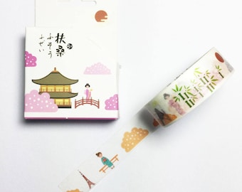 May include: A white washi tape roll with a Japanese design featuring a pagoda, cherry blossoms, and a woman in a kimono. The tape is packaged in a small box with Japanese text that reads "Forest"