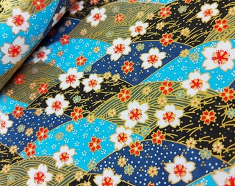 May include: Blue and black fabric with a repeating pattern of white flowers and gold accents. The fabric has a wavy, textured design.