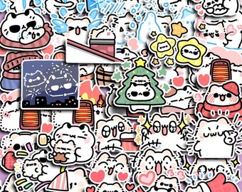May include: A selection of colourful stickers showcasing cartoon cats in diverse poses and settings. Some cats are wearing hats, scarves, or are inside a Christmas tree. Other stickers include hearts, stars, and a cityscape with cat constellations.