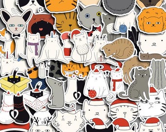 May include: A selection of cat-themed stickers in various colours and designs. The stickers feature cartoon cats with different expressions, some wearing Santa hats or accessories. The stickers are on a grey background.