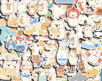 May include: A selection of stickers depicting cartoon bears in diverse scenarios and with various items. The stickers are primarily white, beige, and brown, with touches of blue, red, and green. The stickers vary in size and shape, creating a playful assortment.