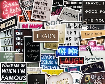 May include: A collection of stickers with inspirational quotes and sayings. The stickers display phrases such as "Learn," "Work Hard," "Love," and "Wake Me Up When I'm Famous." The colour scheme includes white, black, red, and blue.