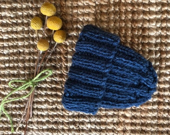 Navy hand knitted baby beanie.