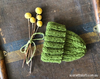 Olive green hand knitted baby beanie.