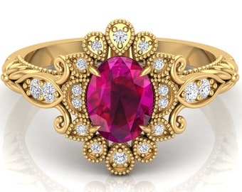 May include: A gold ring featuring a large oval ruby gemstone surrounded by smaller diamonds. The ring has a delicate floral design.