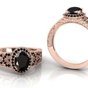 May include: A rose gold engagement ring featuring an oval black diamond surrounded by smaller black diamonds. The band is adorned with intricate scrollwork and black diamonds.