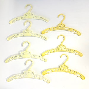 Set of 7 vintage plastic kids hangers with Bambi deer, ducks, bunnies- cute kitschy animal baby hangers, vintage yellow hangers