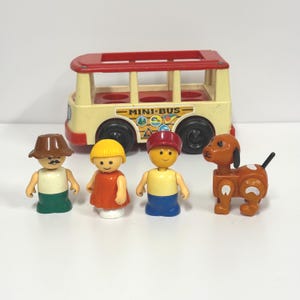 May include: A vintage toy set featuring a yellow and red mini-bus with black wheels, and four plastic figures: three people and a dog. The figures are wearing various outfits and hats. The bus has the words "MINI-BUS" on the side.