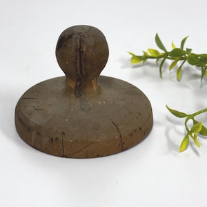 May include: A handmade wooden sign with the text "Welcome" in a playful font. The sign is painted white with a distressed finish, and features a small, decorative heart. It's designed for indoor or outdoor use.