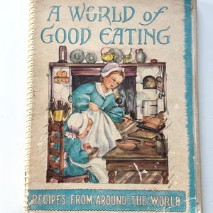Vintage cookbook- A World of Good Eating Recipes From Around the World- Spiral bound paperback cookbook 1951