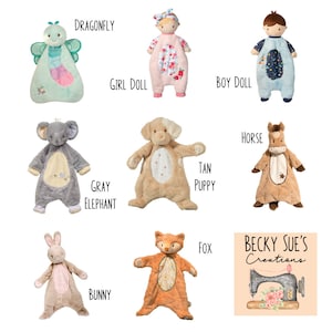 May include: A collection of plush baby toys in various animal and character designs. Includes a dragonfly, girl doll, boy doll, gray elephant, tan puppy, horse, bunny, and fox. Each toy has unique colors and patterns, with the brand name "Becky Sue's Creations" visible.