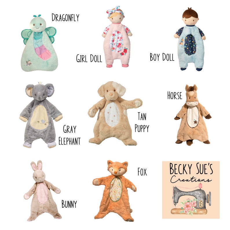 May include: A collection of plush baby toys in various animal and character designs. Includes a dragonfly, girl doll, boy doll, gray elephant, tan puppy, horse, bunny, and fox. Each toy has unique colors and patterns, with the brand name "Becky Sue's Creations" visible.