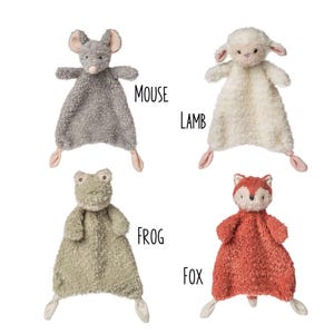 May include: Four plush animal security blankets: a gray mouse, a white lamb, a green frog, and a red fox. Each has a stuffed animal head and a soft, textured blanket body with knotted corners. The word "MOUSE", "LAMB", "FROG", and "FOX" are written next to each animal.