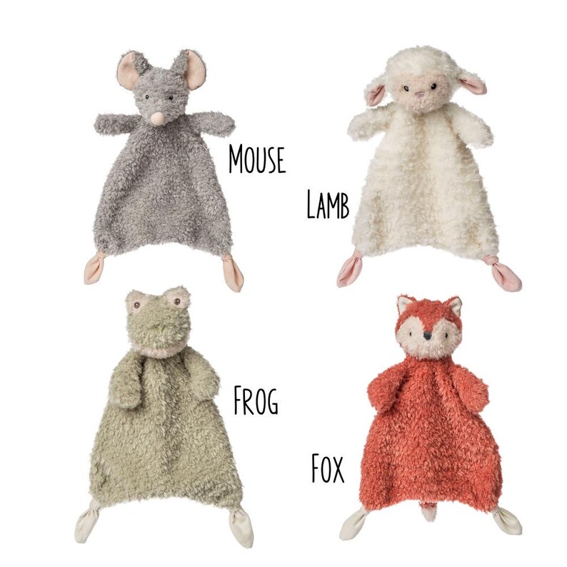 May include: Four plush animal security blankets: a gray mouse, a white lamb, a green frog, and a red fox. Each has a stuffed animal head and a soft, textured blanket body with knotted corners. The word "MOUSE", "LAMB", "FROG", and "FOX" are written next to each animal.