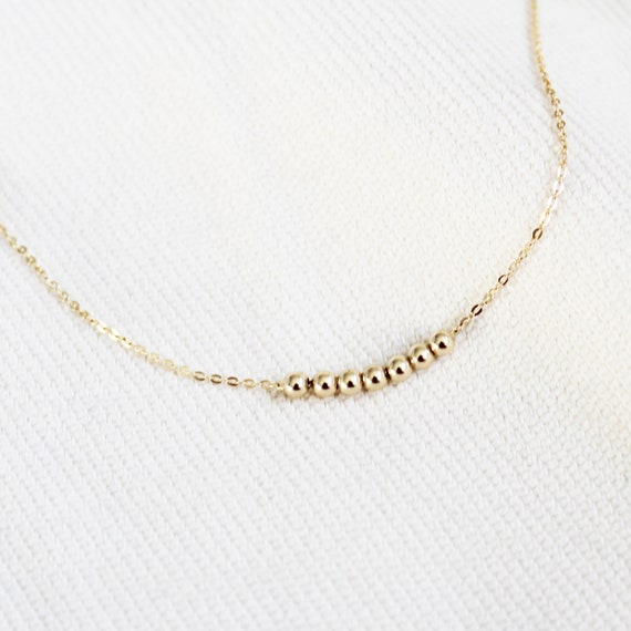 DesignB London dainty beaded necklace with shell pendant | ASOS