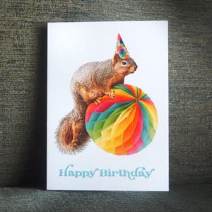 Squirrel on Rainbow Ball Birthday Card
