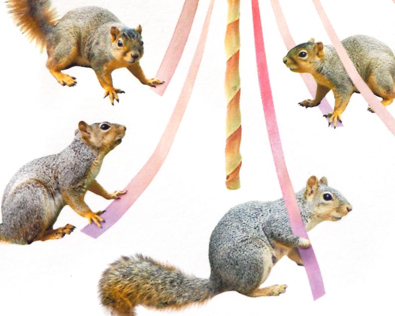 May include: Four gray squirrels are playing around a maypole with pink and orange ribbons. The squirrels are in various poses, some are holding the ribbons in their mouths, and others are jumping.