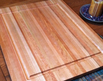 Butcher Block Cherry.  It’s huge!   24"x36"  1 1/4" thick with Juice Groove.  Perfect Christmas gift for the chef in your family.
