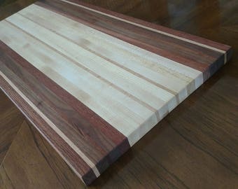 Butcher Block Cutting Board with three or more species.  Each one is an original.  11"x17".  Apx1" thick. Beautiful addition to any kitchen.