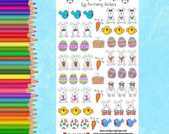 May include: A sheet of colorful Easter egg decorating stickers featuring bunnies, chicks, birds, carrots, and baskets. The stickers are designed by Cindy Urry Design.