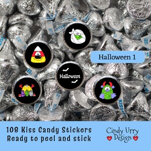 May include: 108 Halloween-themed stickers for Hershey's Kisses candy. The stickers feature a variety of designs, including a mummy, a candy corn, a monster, and a ghost. The text "Halloween 1" is visible in the image.