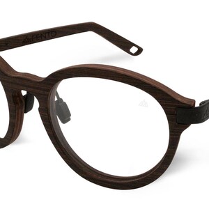 May include: Brown wood-framed round eyeglasses with black metal accents. The brand name "AHITO" is engraved on the frame.